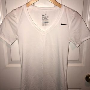 White Nike athletic shirt.